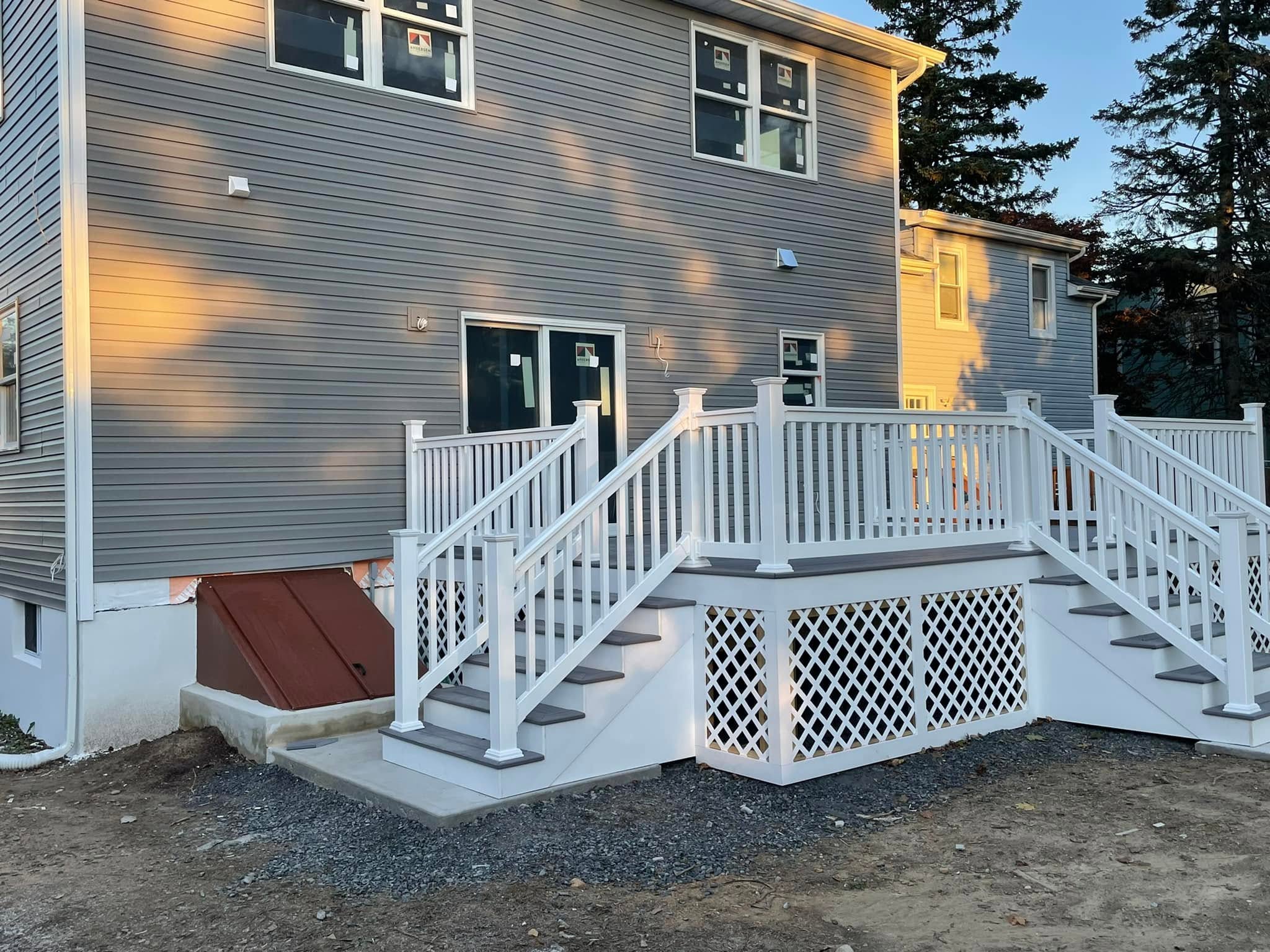 New white deck and railings built by PJ Restorations
